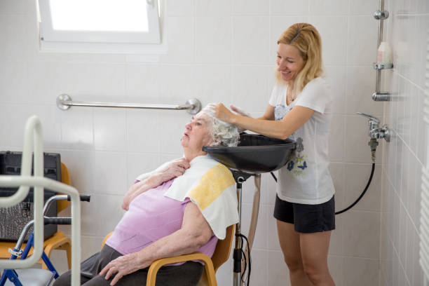Caregiver washing client hair